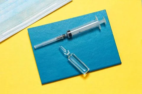 Virus control covid 19 flu shot, mask, syringe and vaccine Stock Photos