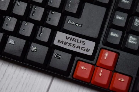 Virus Message write on keyboard isolated on laptop background Stock Photos