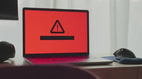 Virus or malware infected laptop displaying message on screen in office or home Video stock 342512204
