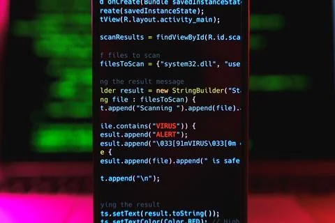 Virus on smartphone device. Programming code with Virus alert input. Malware and 写真素材