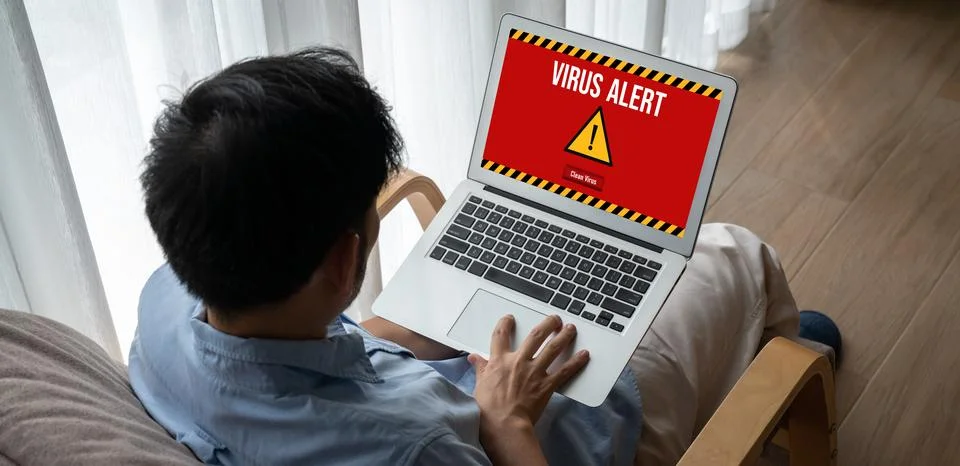 Virus warning alert on computer screen detected modish cyber threat Stock Photos