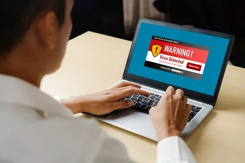 Virus warning alert on computer screen detected modish cyber threat Stock Photos