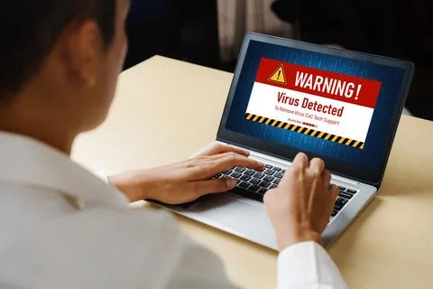 Virus warning alert on computer screen detected modish cyber threat Stock Photos