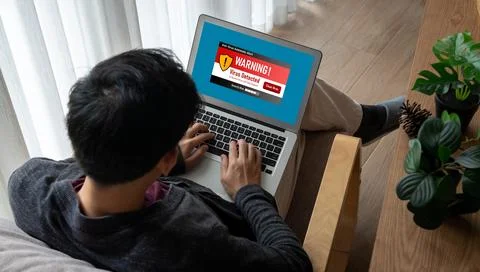 Virus warning alert on computer screen detected modish cyber threat Stock Photos