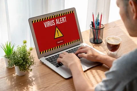 Virus warning alert on computer screen detected modish cyber threat Stock Photos