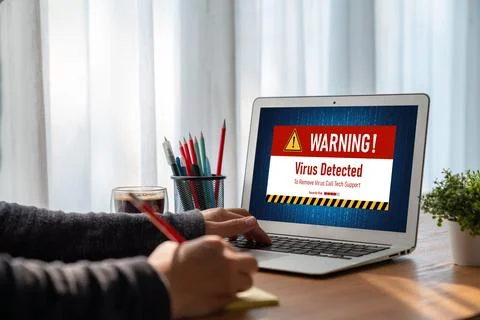 Virus warning alert on computer screen detected modish cyber threat Stock Photos