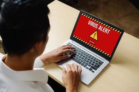 Virus warning alert on computer screen detected modish cyber threat Stock Photos