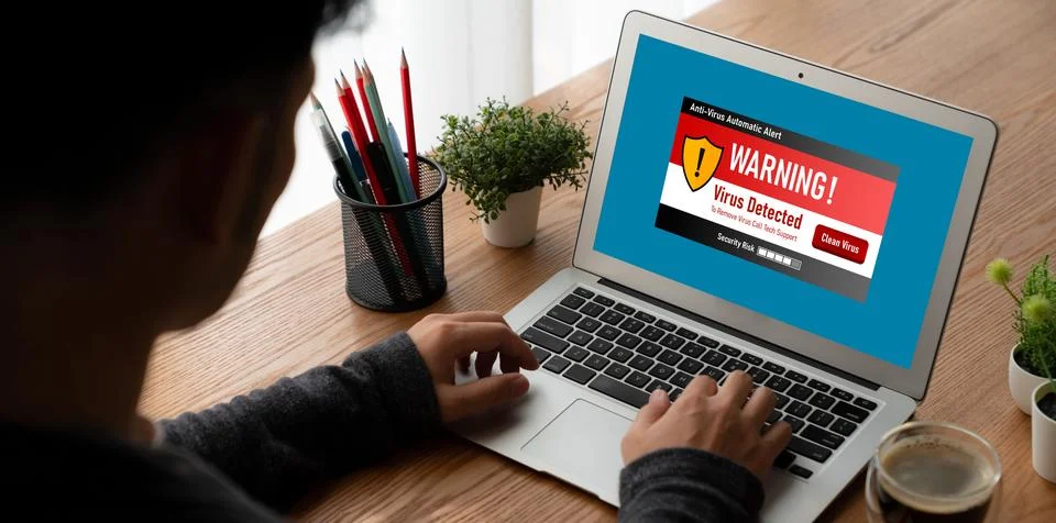 Virus warning alert on computer screen detected modish cyber threat Stock Photos