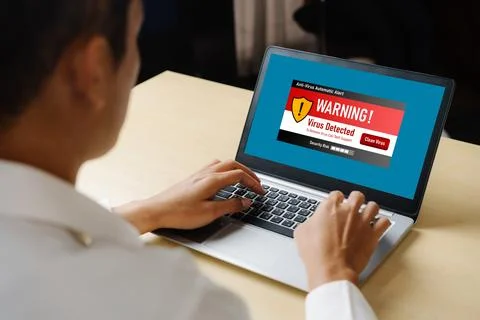 Virus warning alert on computer screen detected modish cyber threat 写真素材
