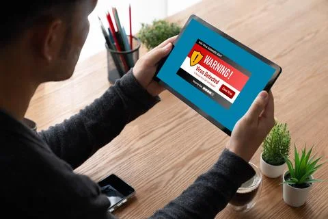 Virus warning alert on computer screen detected modish cyber threat Stock Photos