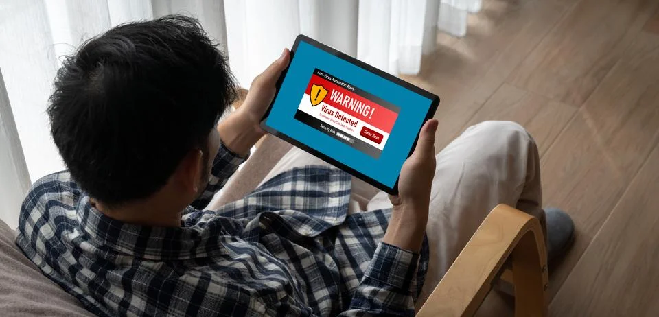 Virus warning alert on computer screen detected modish cyber threat Stock Photos