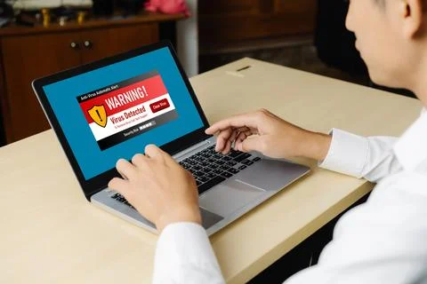 Virus warning alert on computer screen detected modish cyber threat Stock Photos