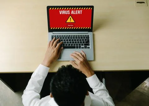Virus warning alert on computer screen detected modish cyber threat Stock Photos