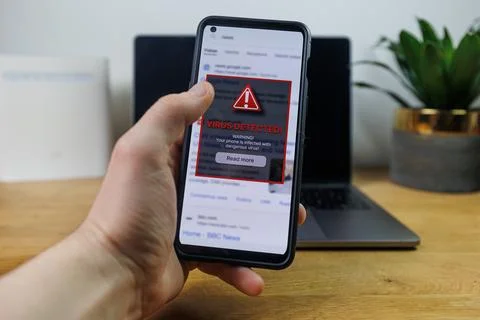 Virus warning notification on phone screen. Dangerous malware virus in phone Stock Photos
