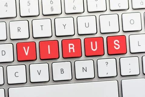 VIRUS writing on white keyboard Stock Photos