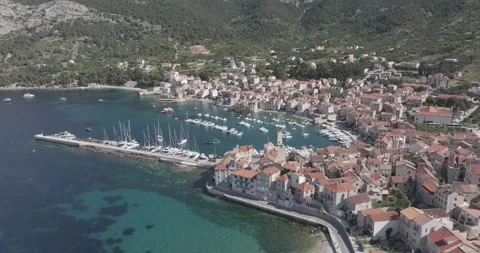 Vis Island: Dynamic Drone Flight Over Komiža Harbor &amp; Yachts Video stock 313483104