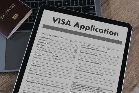 A visa application digital tablet displaying visa application form with passp Stock Photos