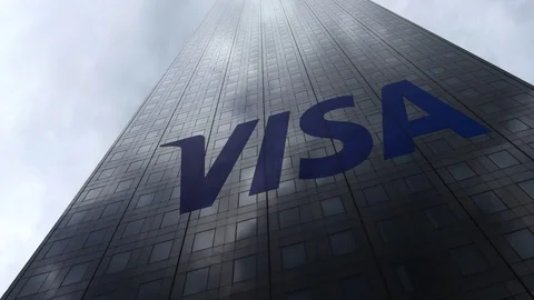 Visa Inc. logo on a skyscraper facade reflecting clouds, time lapse. Editorial Stock Footage 81105511