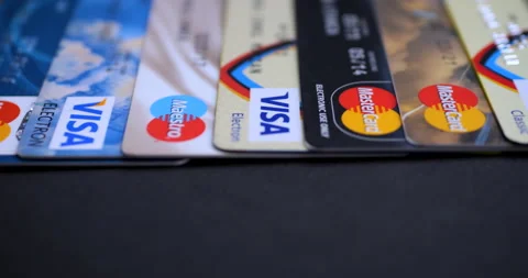 Visa Mastercard Maestro cards on black b... | Stock Video | Pond5