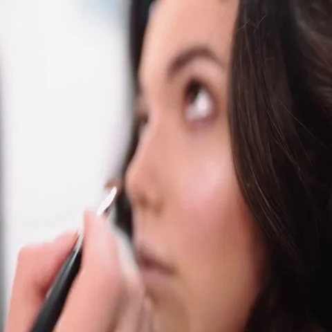 Visage master makes eye make up,make up artist makes eye liner Stock Footage 69413398