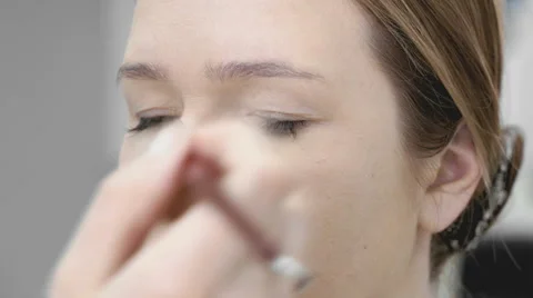 The visage master making make-up for young model 库存影片 63472128