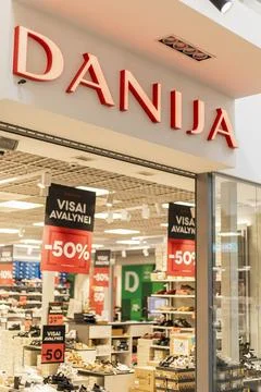 Visaginas, Lithuania - July 22, 2025: A lively shoe store displays various .. Stock Photos