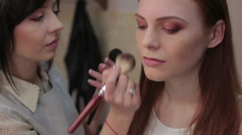 Visagiste makes makeup for  model, professional makeup, Stock Footage 45792241