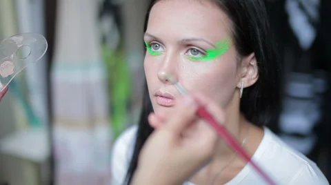 Visagiste makes makeup for  model, professional makeup artist , makeup, body art Stock Footage 46222721