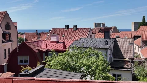 Visby Red-Tiled Rooftops with Baltic Sea Beyond, Sweden Stock-Footage 347671293