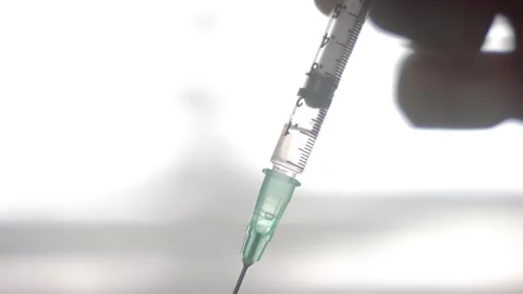 Viscous Liquid Being Drawn Into a Syringe Close Up Stock Footage 346183868