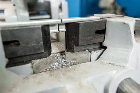 Vise to secure the workpiece. Circular saw machine. Cutting a metal and steel Stock Photos