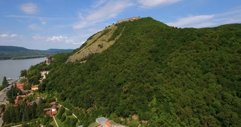 The Visegrad Castle overlooking the Danube bend in Hungary - 4K aerial video Stock-Footage 99290853