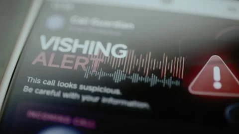 Vishing alert beside voice waveform and warning icon Stock Footage 345488058