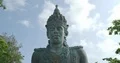 Vishnu monument close up at sunny day with blue sky and moving clouds in Bali 4k or 4k+ Resolution