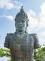 Vishnu monument close up at sunny day with blue sky and moving clouds in Bali Photo