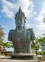 Vishnu monument close up at sunny day with blue sky and moving clouds in Bali Photo