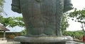 Vishnu monument close up tilt up at sunny day with blue sky and moving clouds 4k or 4k+ Resolution