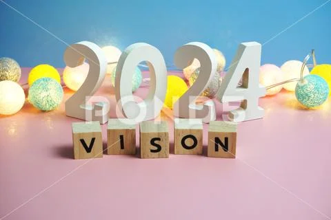 Photograph: Vision 2024 word alphabet letters on pink and blue ...