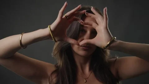 Vision and focus concept, young woman framing face with hands, creative Stock Footage 336939342