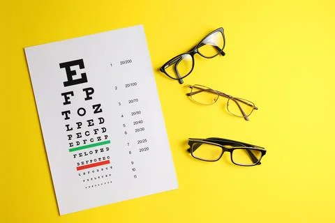 Vision correction glasses on the background of a vision test table with space Foto stock