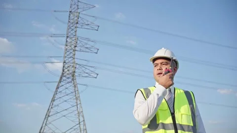 Vision of engineer. Smiling asian electrical engineer working with radio walkie  Stock Footage 149804902