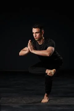 A vision of grace and masculinity, the captivating youth flows through a series Stock Photos