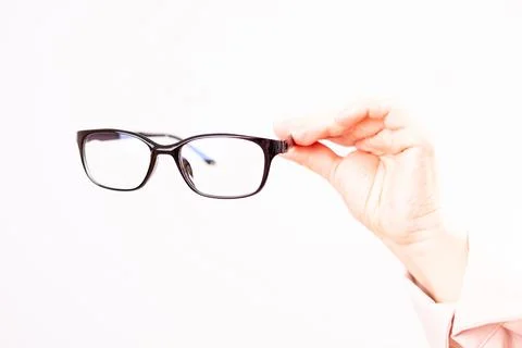 Vision problems, selection of glasses with diopters, white background Stock Photos
