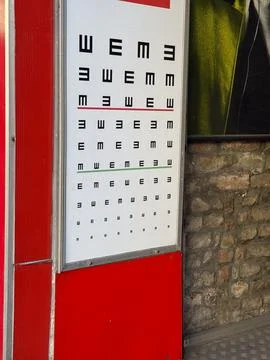 Vision test chart outside optician office. Eye examination, healthcare and .. 写真素材