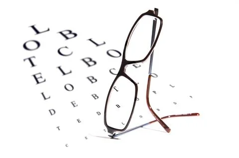 Vision testing chart and glasses Stock Photos