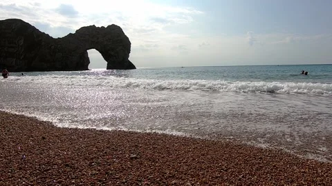 Visit Durdle Door, during COVID-19 pandemic, 2020. Waves Stock Footage 144138617