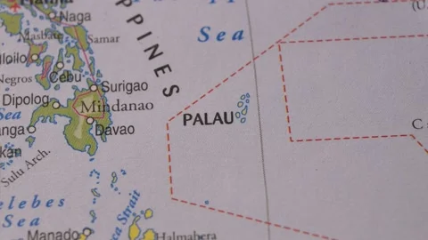 Visit Next text label placed on map targeting Palau island destination Stock Footage 346744290