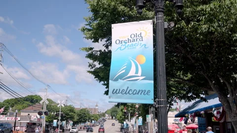 Visit Old Orchard Beach Maine welcome banner over downtown street, slow push in Stock Footage 337862995