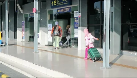Visitor activities in front of Pasar Turi train station Stock Footage 302072348