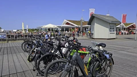 Visitor beach goer Biker St. Peter Ording beach resort, ticket booth, Stock Footage 313807529